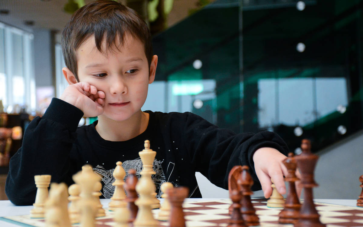 Boy playing chess at DOKK1.